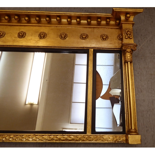 365 - A Regency design gilt framed overmantel mirror with ball ornament  24