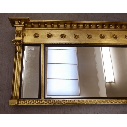 365 - A Regency design gilt framed overmantel mirror with ball ornament  24