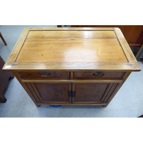 369 - A modern Chinese elm side cabinet with two drawers and two doors, raised on bracket feet  31