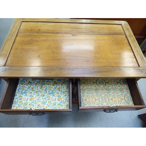 369 - A modern Chinese elm side cabinet with two drawers and two doors, raised on bracket feet  31