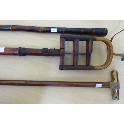 371 - Shooting and walking sticks: to include an example with a brass claw hammer handle