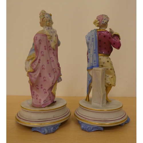 48 - Four painted bisque figures: to include one featuring a man in a frockcoat, on an oval pedestal ... 