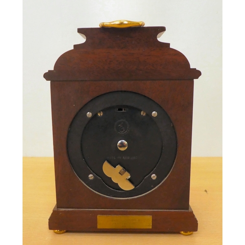 55 - A modern Elliott Garrard & Co mahogany cased mantel clock; the movement faced by a Roman dial&nb... 