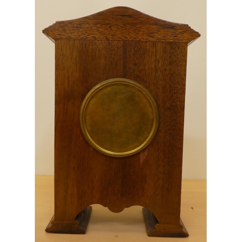 60 - An Edwardian satinwood inlaid, mahogany cased mantel clock; the movement faced by a Roman dial ... 