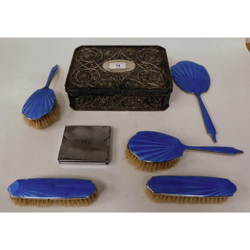 74 - A mixed lot: to include a white metal and blue enamel backed, five piece dressing table set