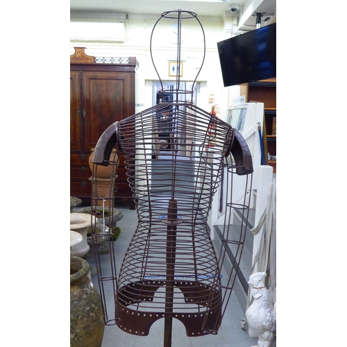 23 - A painted wirework framed dress maker's dummy, on a stand  60