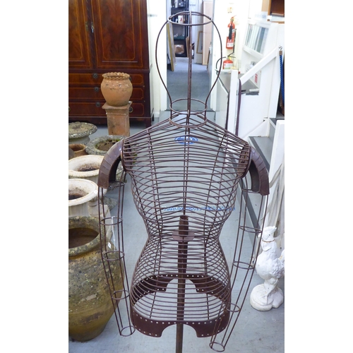 23 - A painted wirework framed dress maker's dummy, on a stand  60