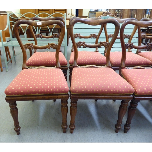 358 - A set of eight William IV rosewood framed balloon back dining chairs, raised on octagonal tapered le... 