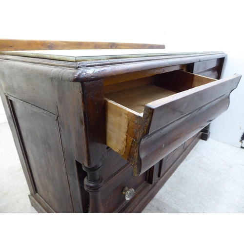 118 - A 19thC painted pine cabinet with a mid 20thC Formica top, over two frieze drawers and a central cup... 