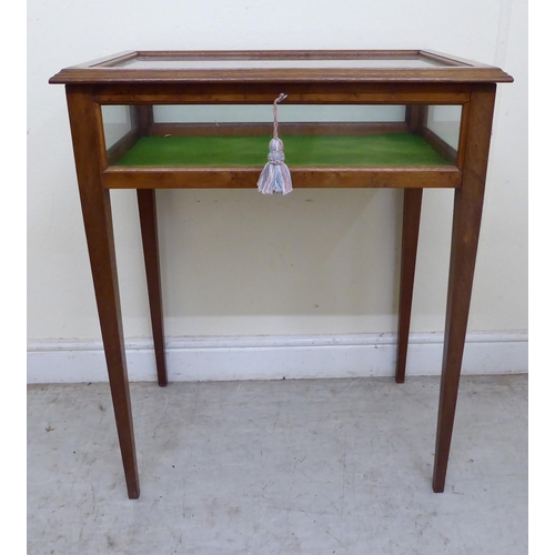 138 - A 20thC yewwood display table, raised on square, tapered legs  30