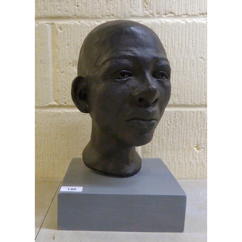 140 - Sandra Lawless - an African bust of a boy, on a plinth  14