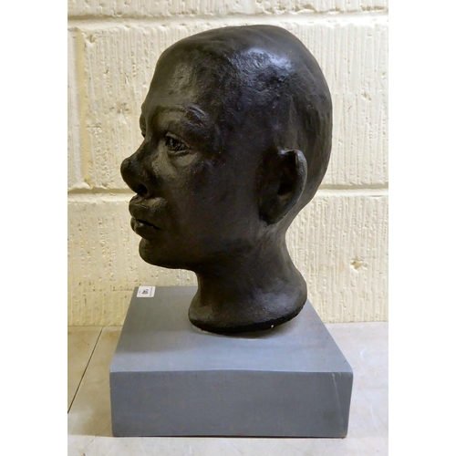 140 - Sandra Lawless - an African bust of a boy, on a plinth  14