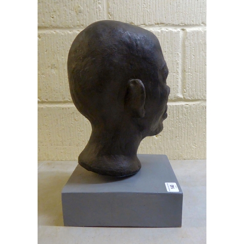 140 - Sandra Lawless - an African bust of a boy, on a plinth  14