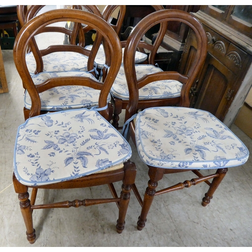 145 - A set of six Victorian style, stained beech framed balloon and bar back dining chairs, raised on tur... 