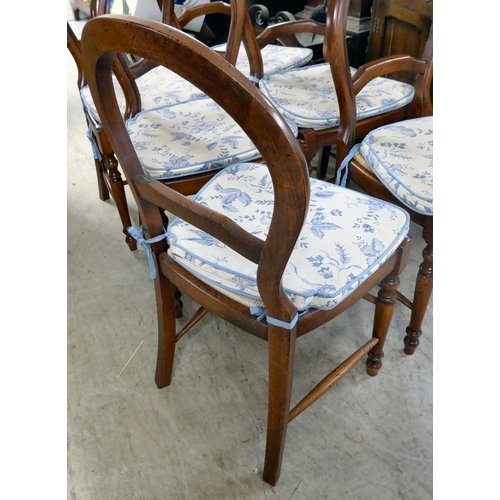 145 - A set of six Victorian style, stained beech framed balloon and bar back dining chairs, raised on tur... 