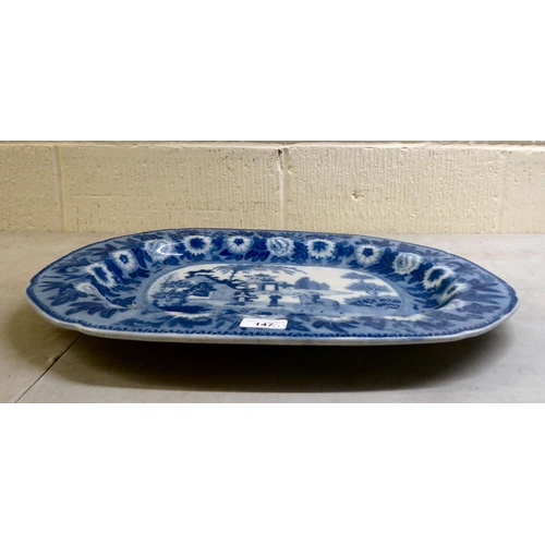 147 - A 19thC china meat plate, decorated in blue and white with a Chinese landscape  21