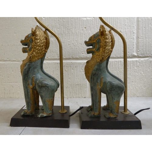 149 - A pair of modern cast metal table lamps, fashioned as Dogs of Fo, on plinths  16