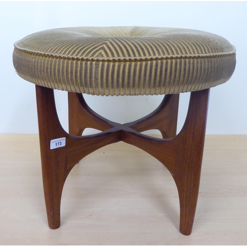 173 - A 1980s teak framed and fabric upholstered top dressing table stool, raised on splayed legs