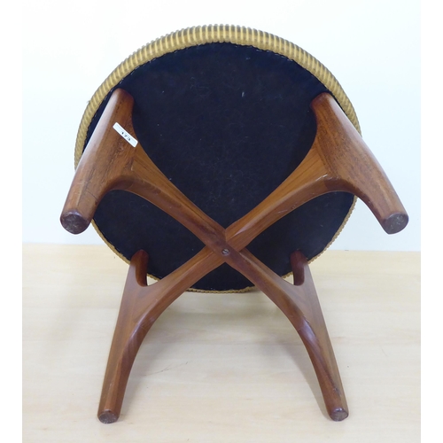 173 - A 1980s teak framed and fabric upholstered top dressing table stool, raised on splayed legs