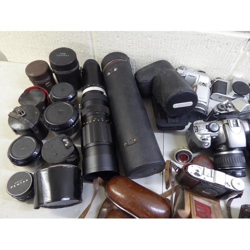 184 - Cameras and photographic equipment: to include a 'Pentax Asahi'; and an 'Olympus OM101'