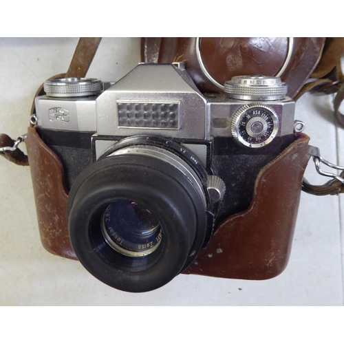 184 - Cameras and photographic equipment: to include a 'Pentax Asahi'; and an 'Olympus OM101'