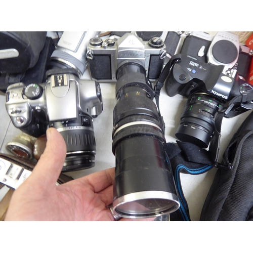 184 - Cameras and photographic equipment: to include a 'Pentax Asahi'; and an 'Olympus OM101'