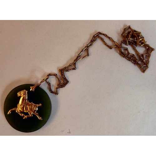 211 - A Chinese Jade 14ct gold mounted pendant necklace, on a 12ct gold chain