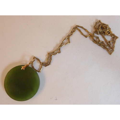 211 - A Chinese Jade 14ct gold mounted pendant necklace, on a 12ct gold chain