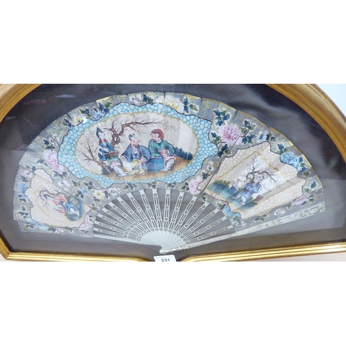 231 - An Oriental fan  cased