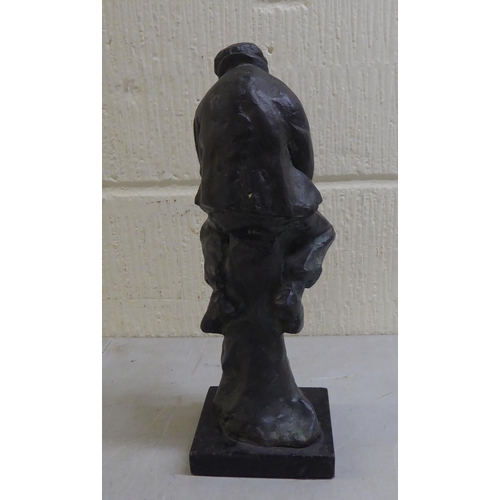 27 - A modern bronze figure of a man, on a pedestal, on a plinth  13