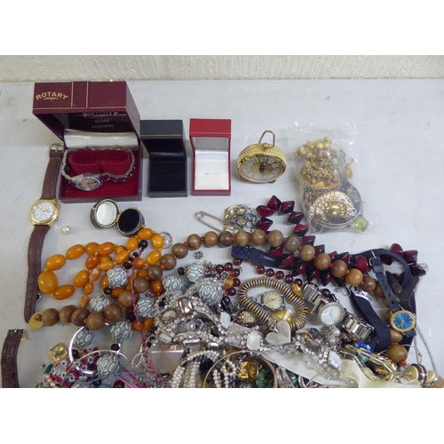 37 - Costume jewellery: to include amber coloured beads; and variously cased and strapped wristwatches