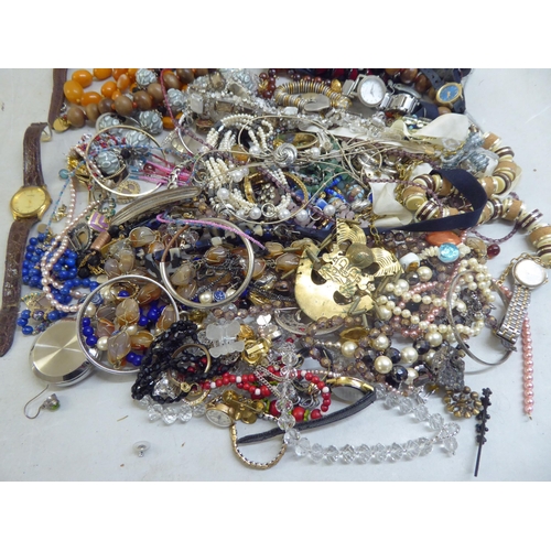 37 - Costume jewellery: to include amber coloured beads; and variously cased and strapped wristwatches