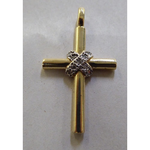 372 - A 9ct gold and diamond set crucifix pendant