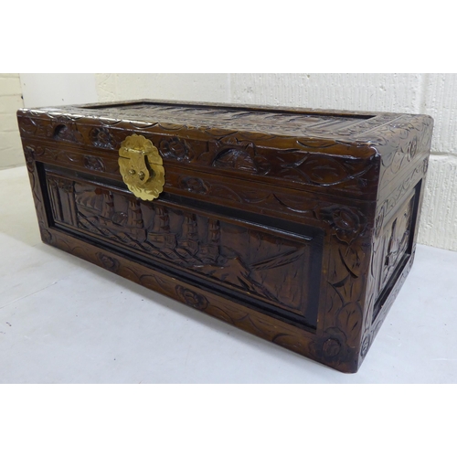 45 - A modern Chinese carved and varnished hardwood chest with straight sides and a hinged lid  11