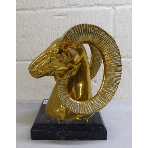 48 - A modern cast brass ram's head, on a plinth  13