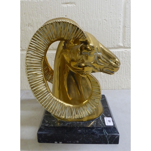 48 - A modern cast brass ram's head, on a plinth  13