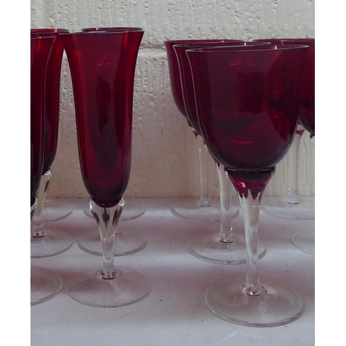 49 - Glassware: to include clear and cranberry coloured pedestal and flutes