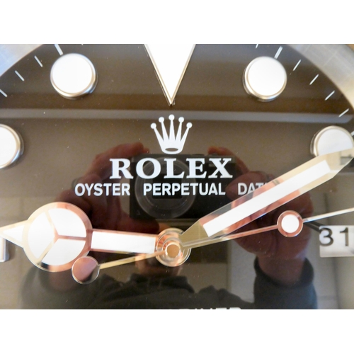 64 - A dealer display advertising wall timepiece for Rolex Oyster Perpetual; the movement faced by a bato... 