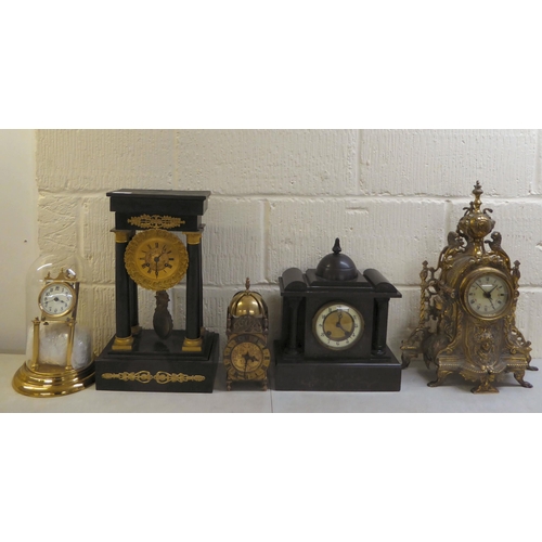 74 - Clocks and timepieces: to include a late 19thC (probably French), black painted and brass mounted ex... 