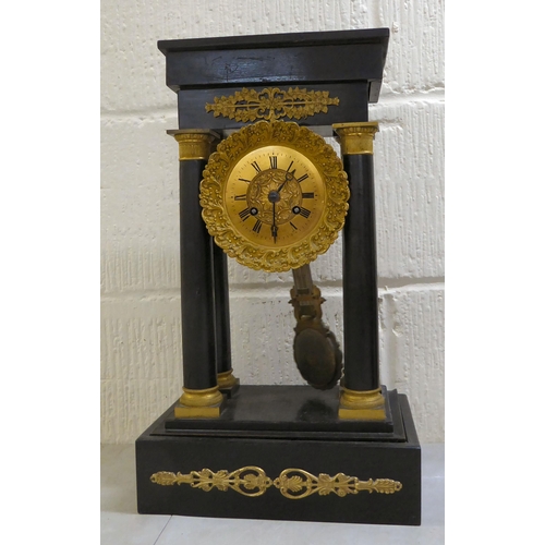 74 - Clocks and timepieces: to include a late 19thC (probably French), black painted and brass mounted ex... 