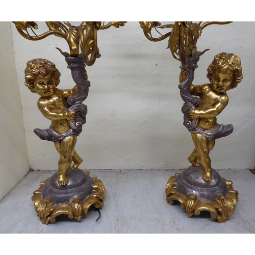 81 - A pair of 20thC silvered and gilded softwood and gilt metal mounted, four branch candelabra  29... 