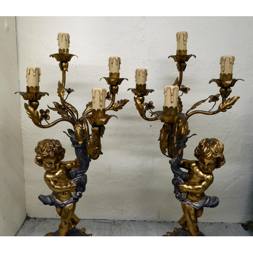 81 - A pair of 20thC silvered and gilded softwood and gilt metal mounted, four branch candelabra  29... 