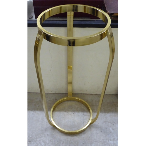 82 - A modern lacquered brass torchere  35