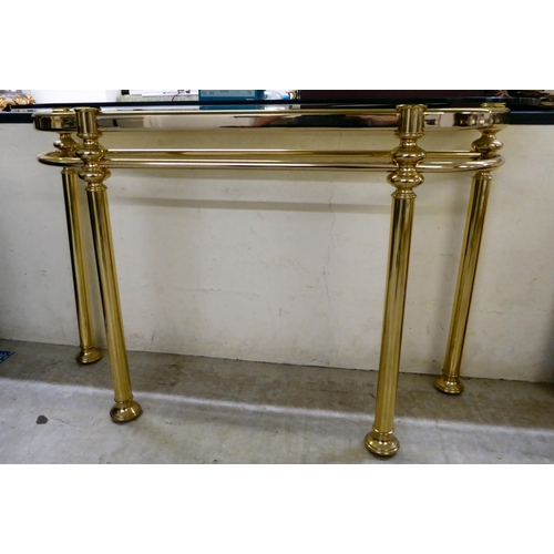 84 - A modern lacquered brass D-shaped console table with a tinted smokey coloured glass top  30