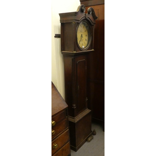 123 - A late 19thC oak cased longcase clock; the movement faced by a Roman and Arabic dial, inscribed JN W... 