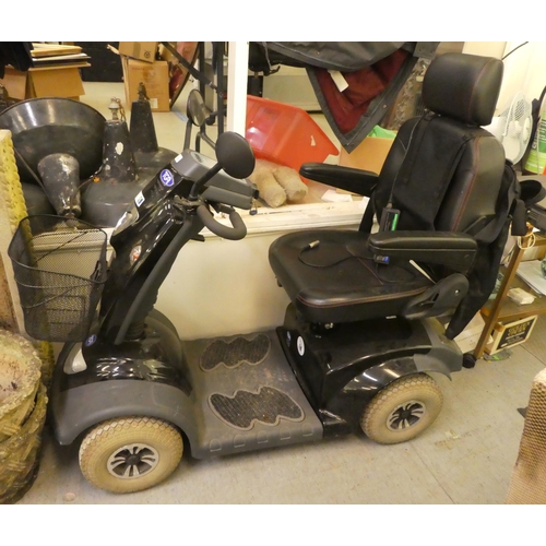 370 - A TGA Mobility World battery powered, four wheeled scooter with power leads (to be sold as seen, nei... 