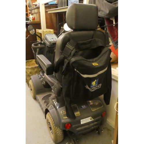 370 - A TGA Mobility World battery powered, four wheeled scooter with power leads (to be sold as seen, nei... 