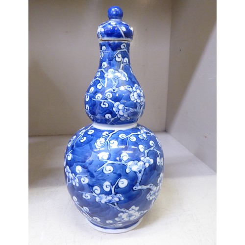 17 - 19thC and later Oriental ceramics: to include a pair of late 19thC Chinese porcelain, tapered vases,... 