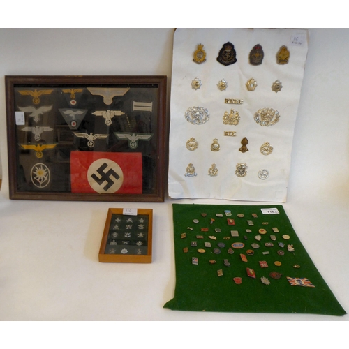 122 - World War II military collectables, some copies: to include German cloth badges(Please Note: this lo... 