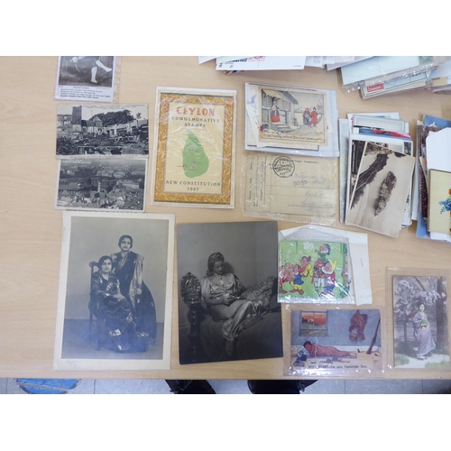 106 - Uncollated early 20thC ephemera; postcards; and used postage stamps on letters